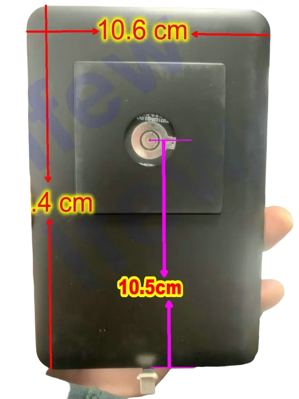 Black rectangular tablet wall mount magnetic bracket with circular metallic center for ipad charger attachment