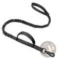 Black tactical bungee dog leash with elastic cord, sturdy webbing handle, and metal clip for dual control use