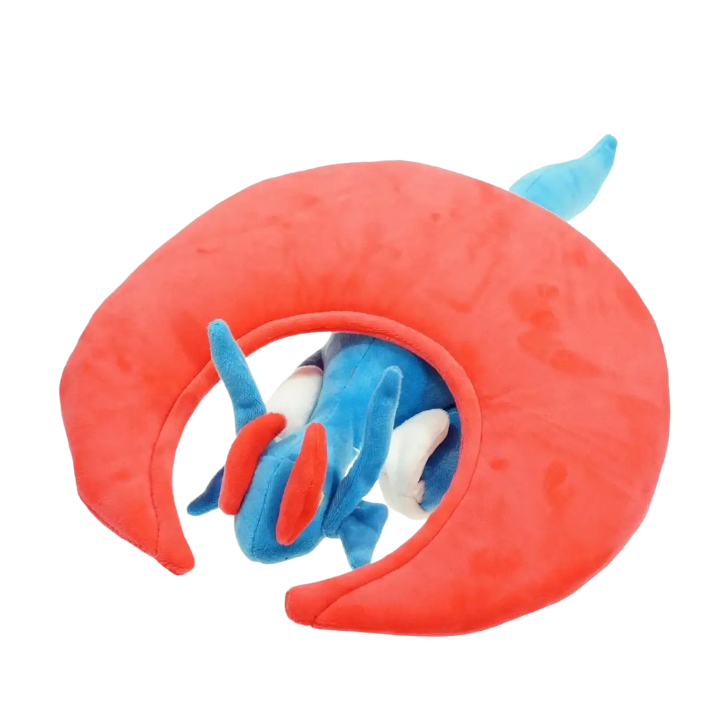Takara tomy pokemon mudkip plush toy with blue white red accents nestled inside a large orange crescent shell