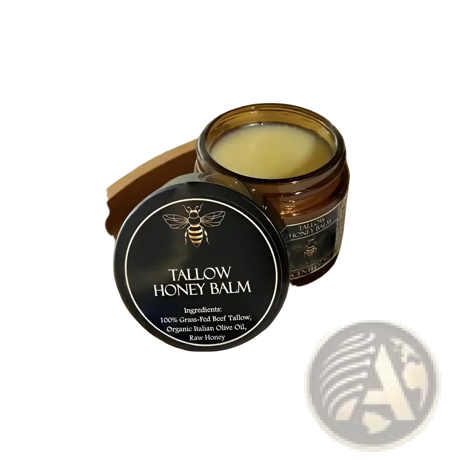 A sleek black lid with gold bee emblem and white text labels tallow honey balm in amber jar of pale yellow cream
