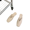 Tan leather square toe mule flat slippers in cream color with slip-on design and soft leather-like material