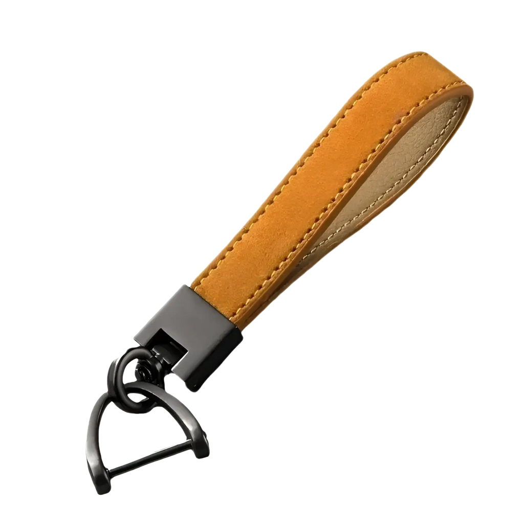 Tan suede leather car keychain ring with black metal hardware and d-shaped ring for secure key attachment