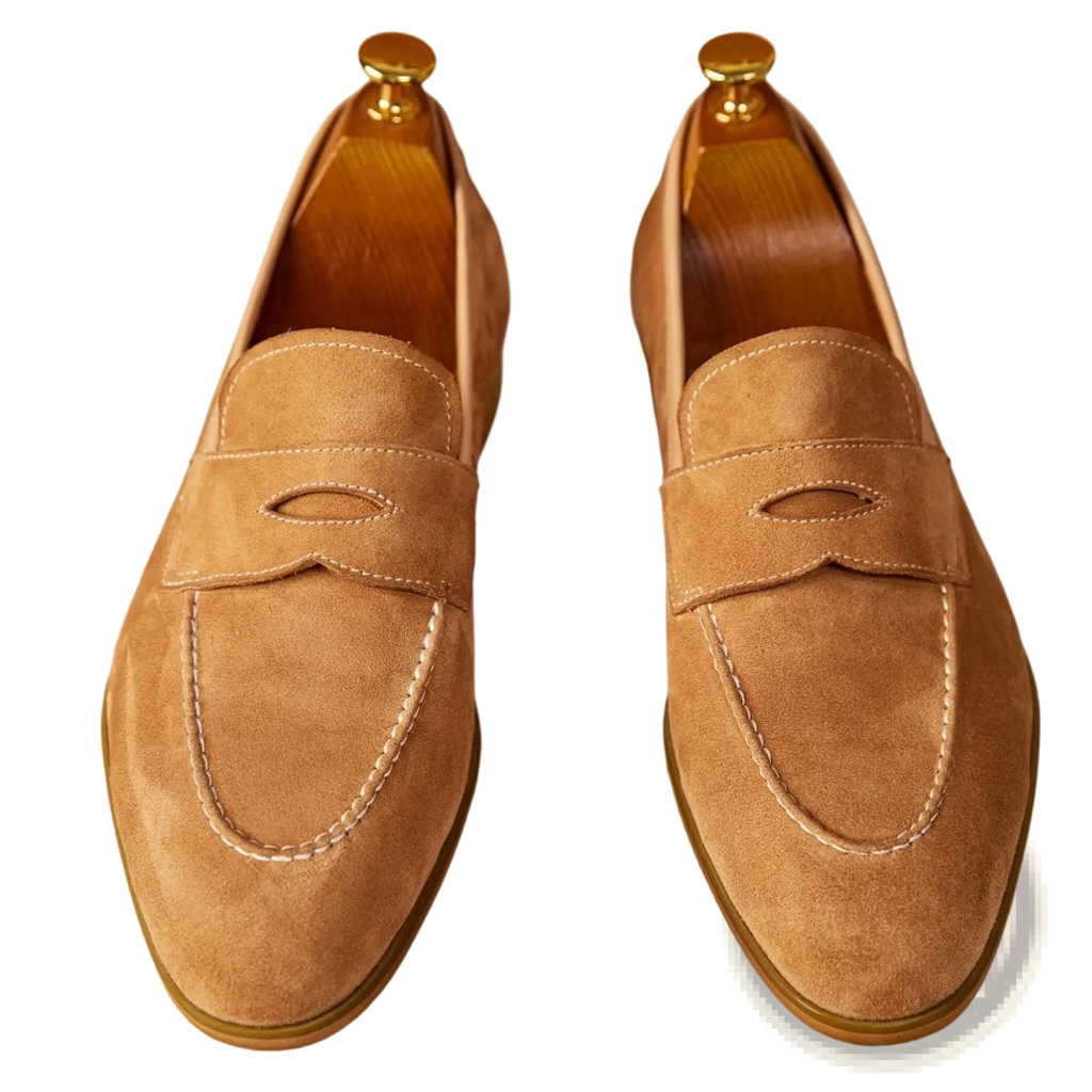 Tan suede penny loafers with white contrast stitching featuring classic design and gold-toned shoe trees