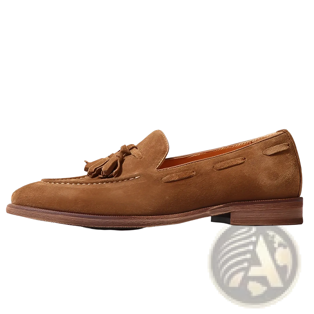 Tan suede tassel loafers with stitched leather accents and rubber sole shown from the back side