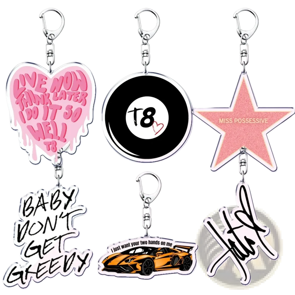Pink heart-shaped acrylic Tate Mcrae keychain with dripping paint effect and black text live now think later i do it so well t8