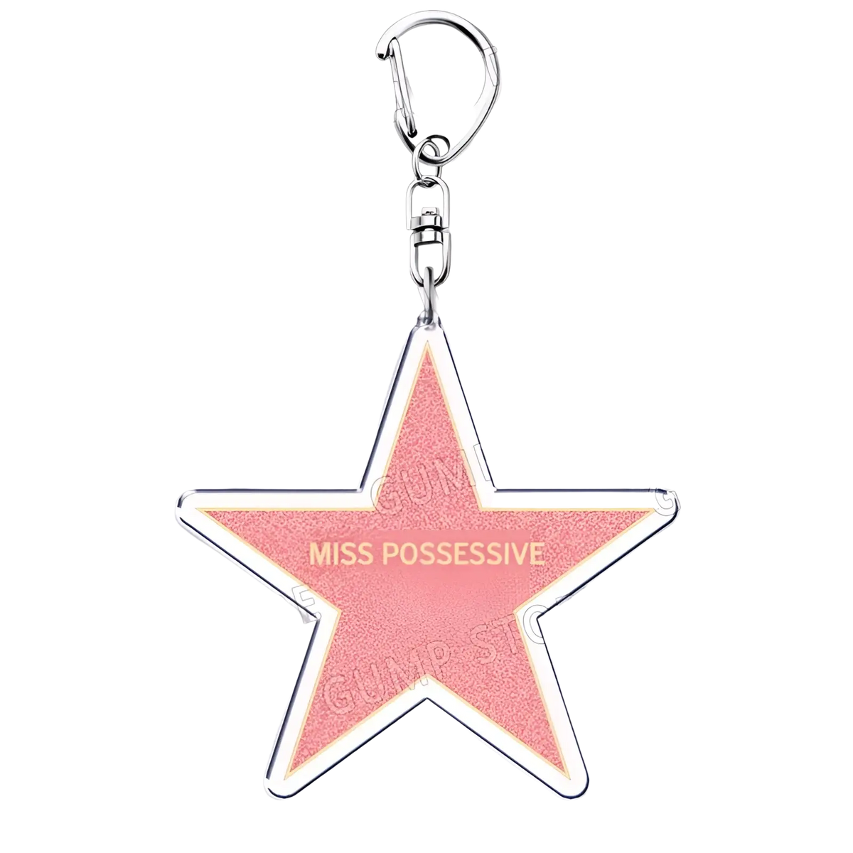 A pink star-shaped acrylic keychain with silver outline and gold miss possessive text for Tate Mcrae music fans