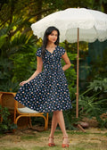 Greta tea party navy blue cotton wrap dress with floral print short sleeves v-neckline and pockets