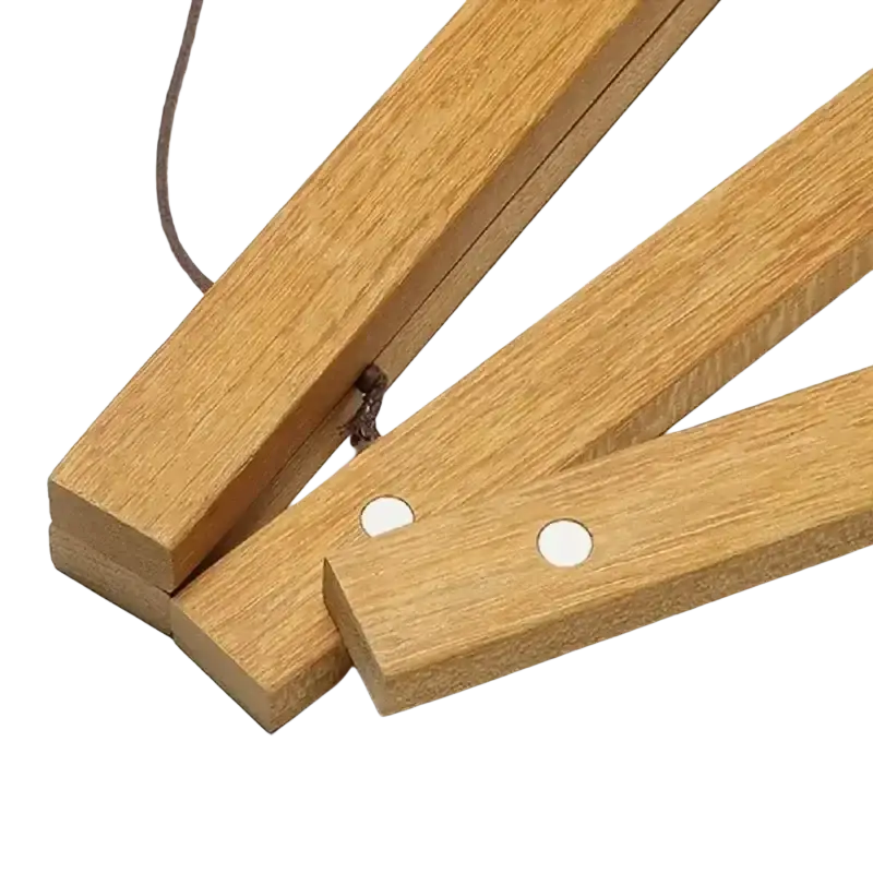 Light brown teak wood folding ruler with white circular holes and dark cord used with photo frame poster hanger