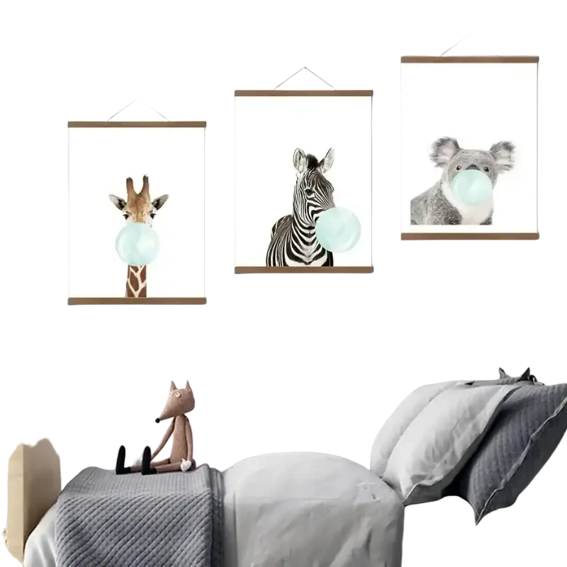 Three framed animal prints of a giraffe zebra and koala blowing blue bubblegum in teak wood photo frames