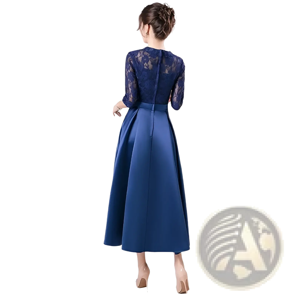 A navy blue evening gown with a lace bodice and satin skirt designed as a teal lace satin midi birthday dress