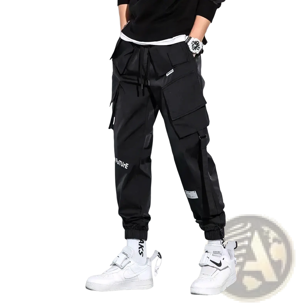 Black mens tactical cargo pants with multiple pockets drawstring waistband and white text on leg for streetwear
