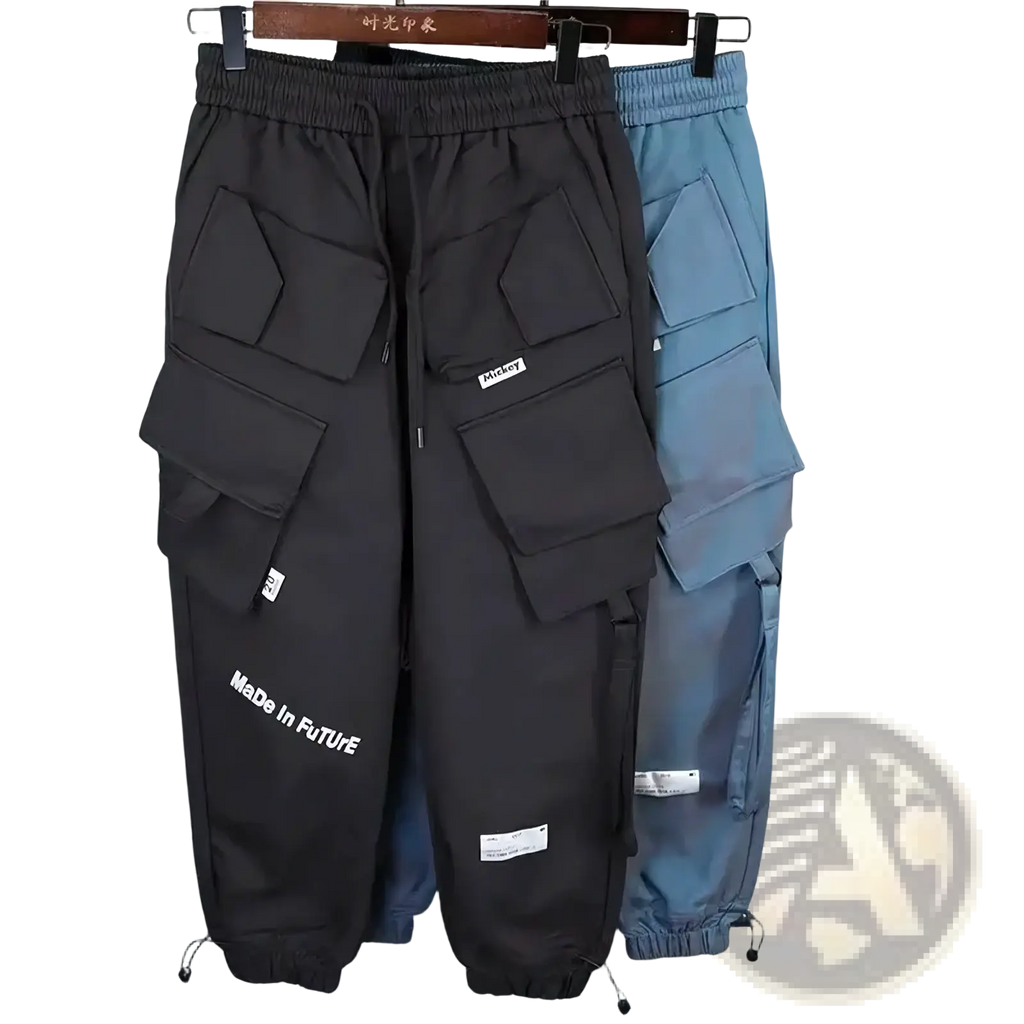 Teal mens tactical cargo pants in black with multiple pockets and drawstring waist featuring made in future text