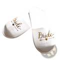 White slip-on slippers with gold foil bride script and arrow-heart design for team bride bachelorette party