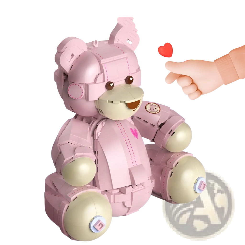 Pink robotic teddy bear constructed from interlocking plastic bricks with beige joints and pink heart emblem on chest