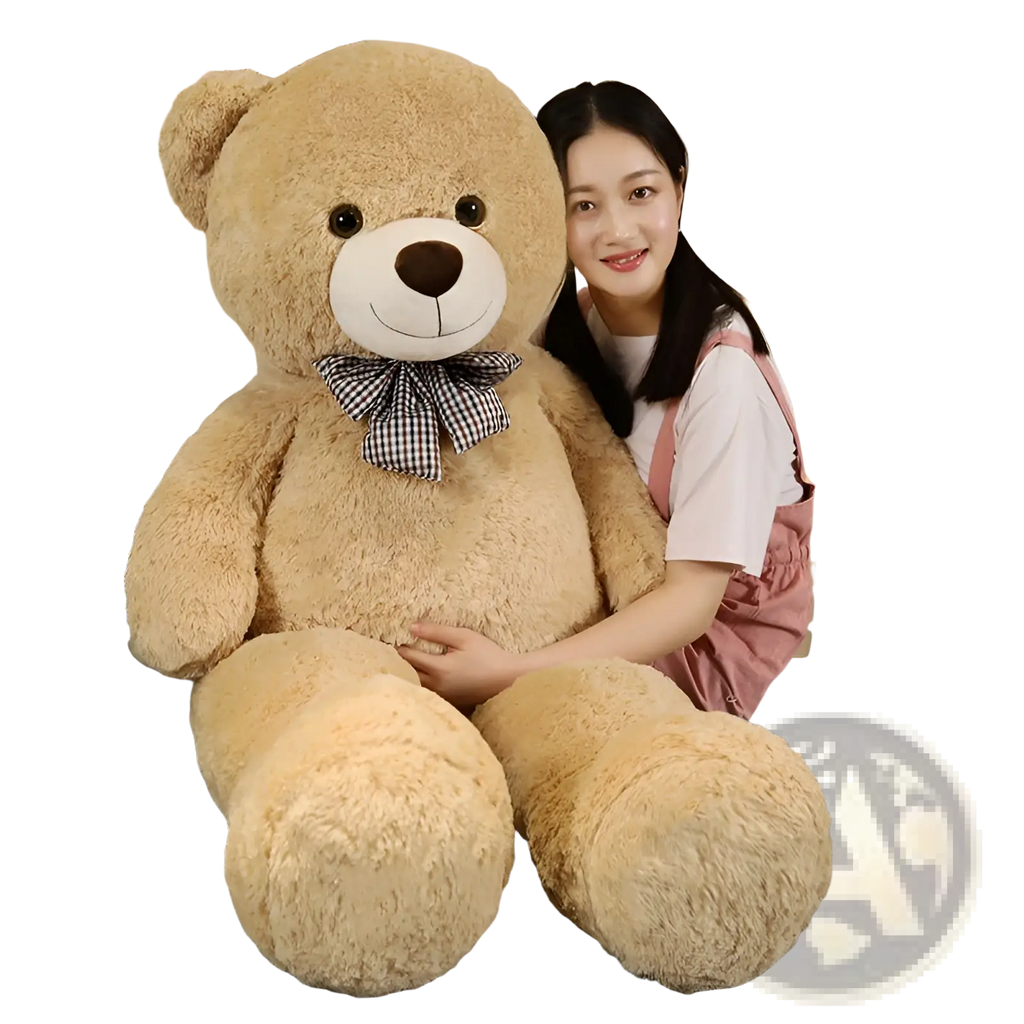 A plush tan teddy bear with a white snout, black button eyes, and a checkered bow tie teddy bear plush toy