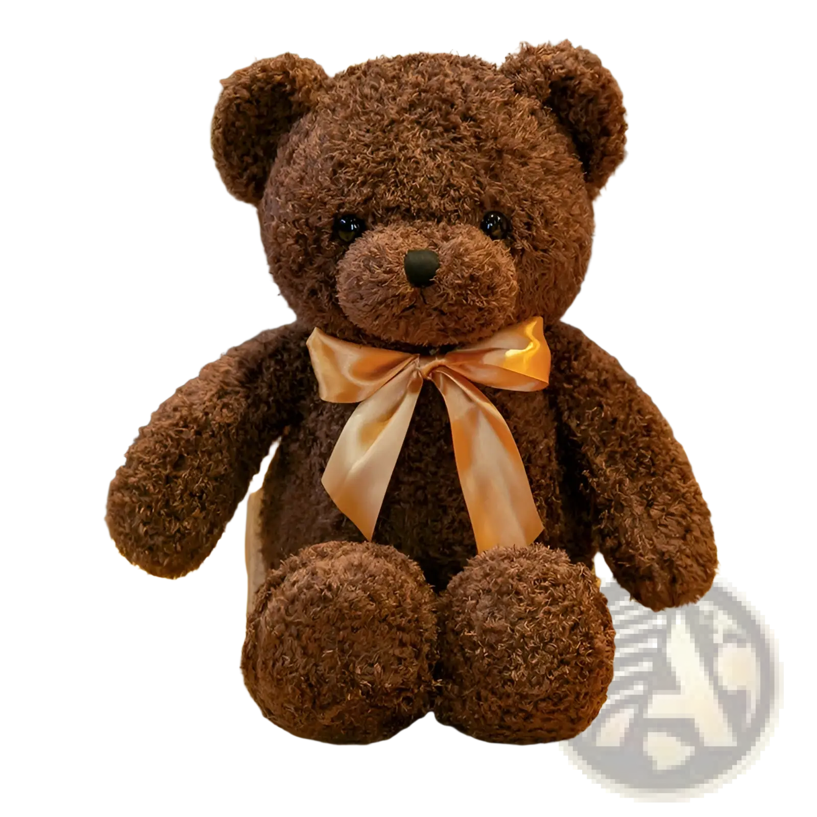 A plush brown teddy bear with soft curly fur and shiny black eyes sitting on a wooden table stuffed animal doll