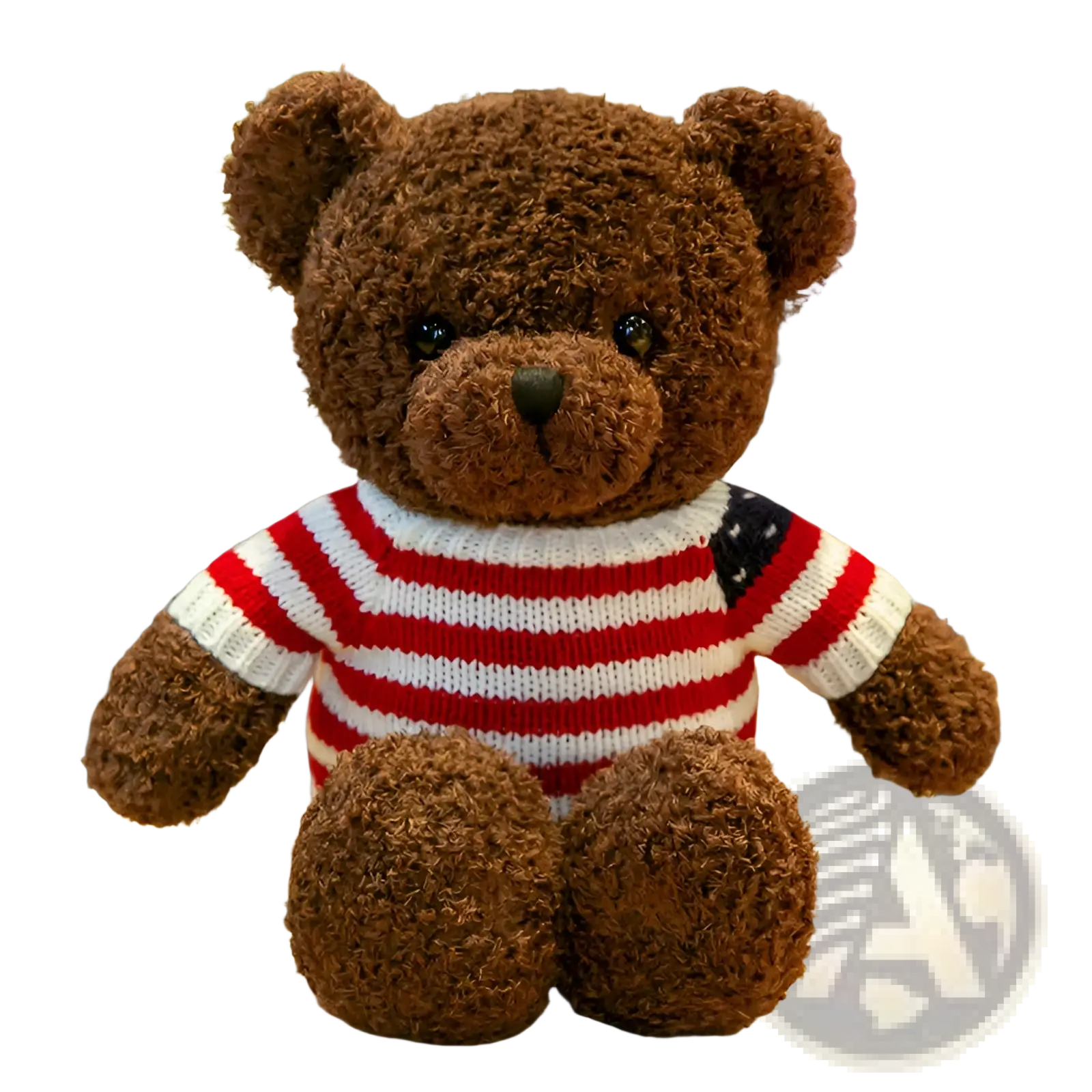 A plush brown teddy bear wearing a red and white striped knit sweater with an American flag patch on the shoulder
