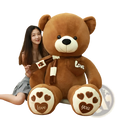 A plush brown teddy bear with white paw pads and a heart love patch holding an ice cream cone soft stuffed animal