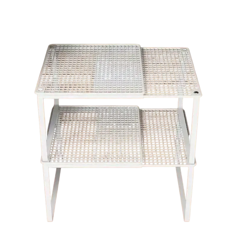 White plastic two-tiered stackable telescopic closet shelf with grid surface and angled legs for expandable wardrobe divider