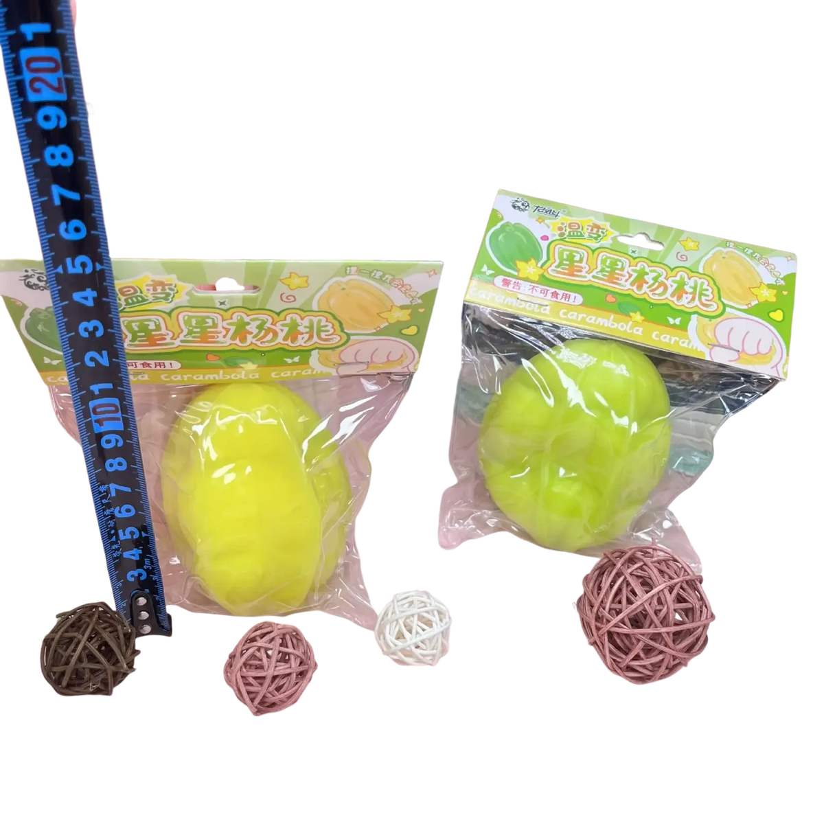 Bright yellow and lime green squishy caramel apple stress balls in clear packaging with colorful cartoon branding temperature changing star fruit squishy toy
