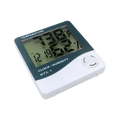 White and dark green digital indoor hygrometer clock displaying current time temperature and humidity measurement readings