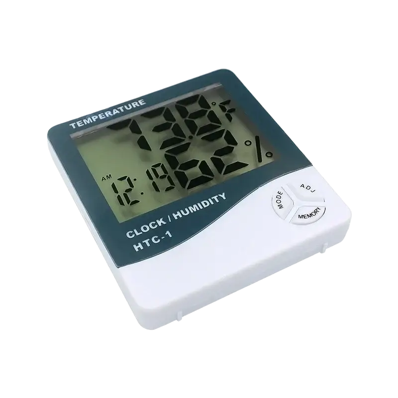 White and dark green digital indoor hygrometer clock displaying current time temperature and humidity measurement readings