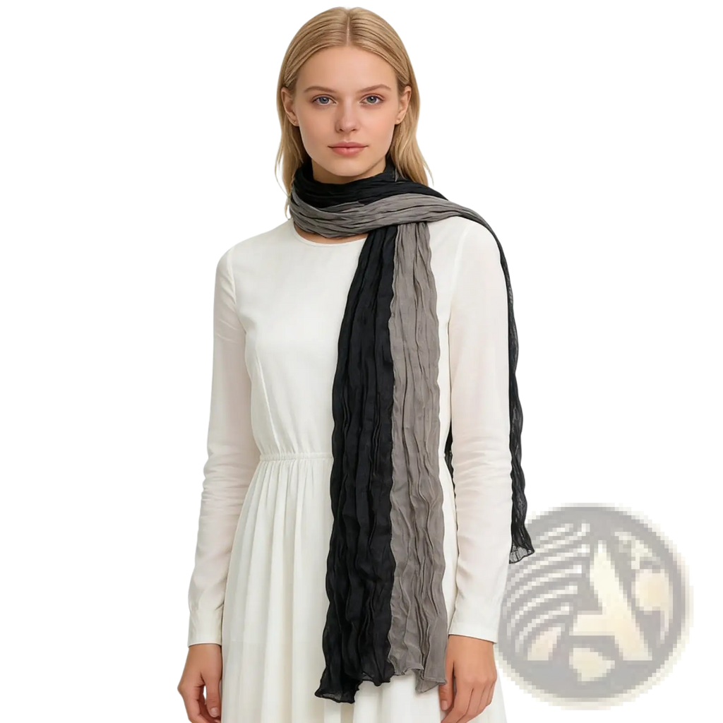 A textured black gray crinkle scarf with soft draped fabric featuring vertical gradient stripes from black to gray