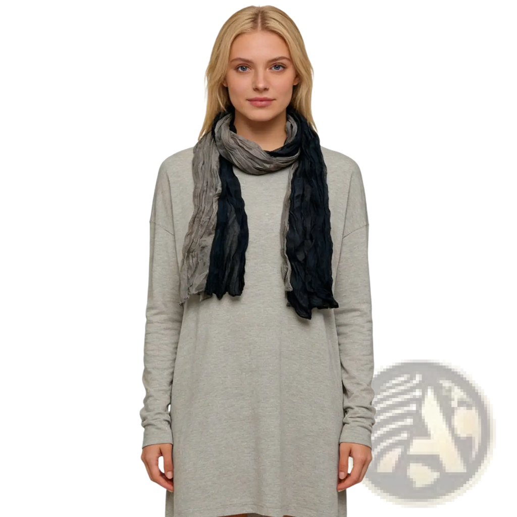 A soft textured black gray crinkle scarf with a gradient draped elegantly around the model’s neck