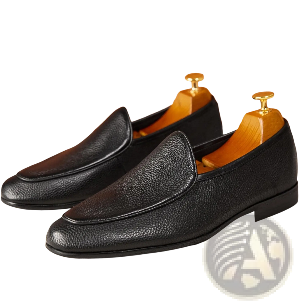 Black leather loafers with pebbled textured cowhide leather and a classic pointed toe slip-on design