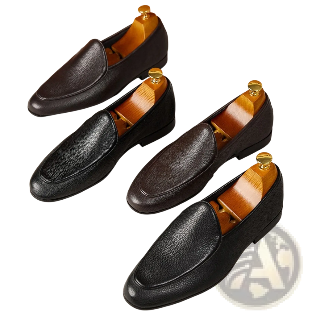 Black textured cowhide leather pointed toe loafers with pebbled finish and gold-toned shoe trees inside