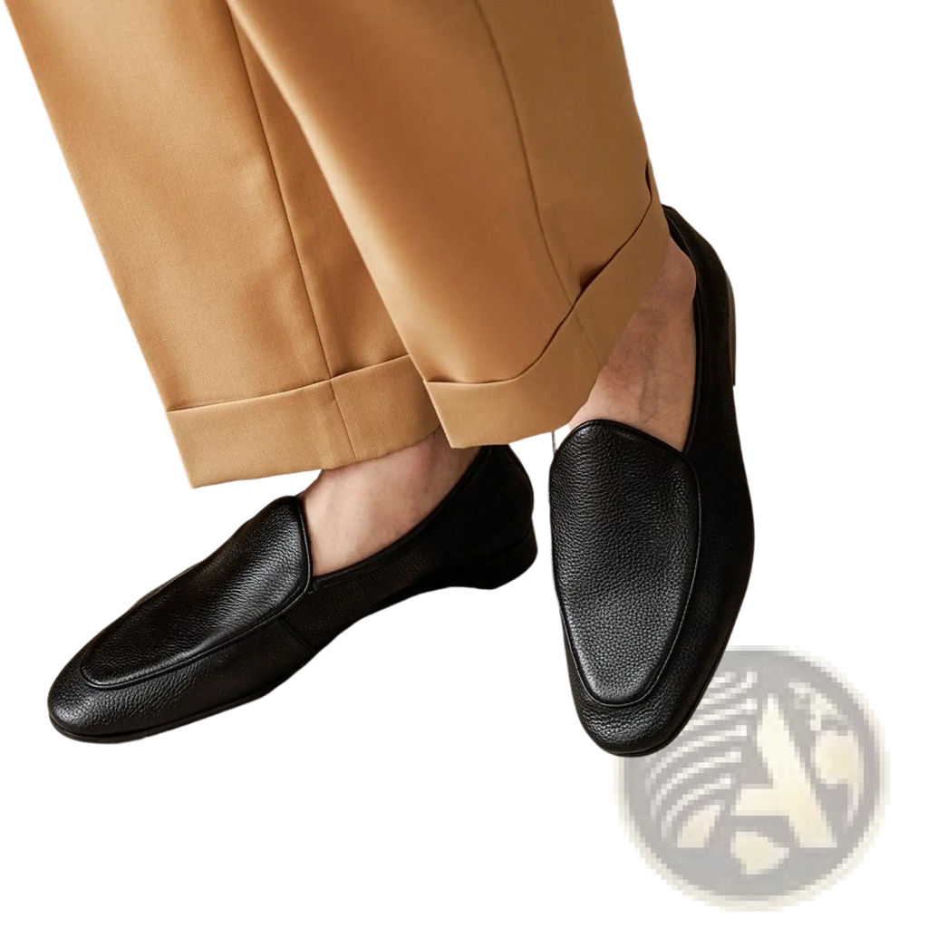Black textured cowhide leather pointed toe loafers with a classic slip-on design for formal wear