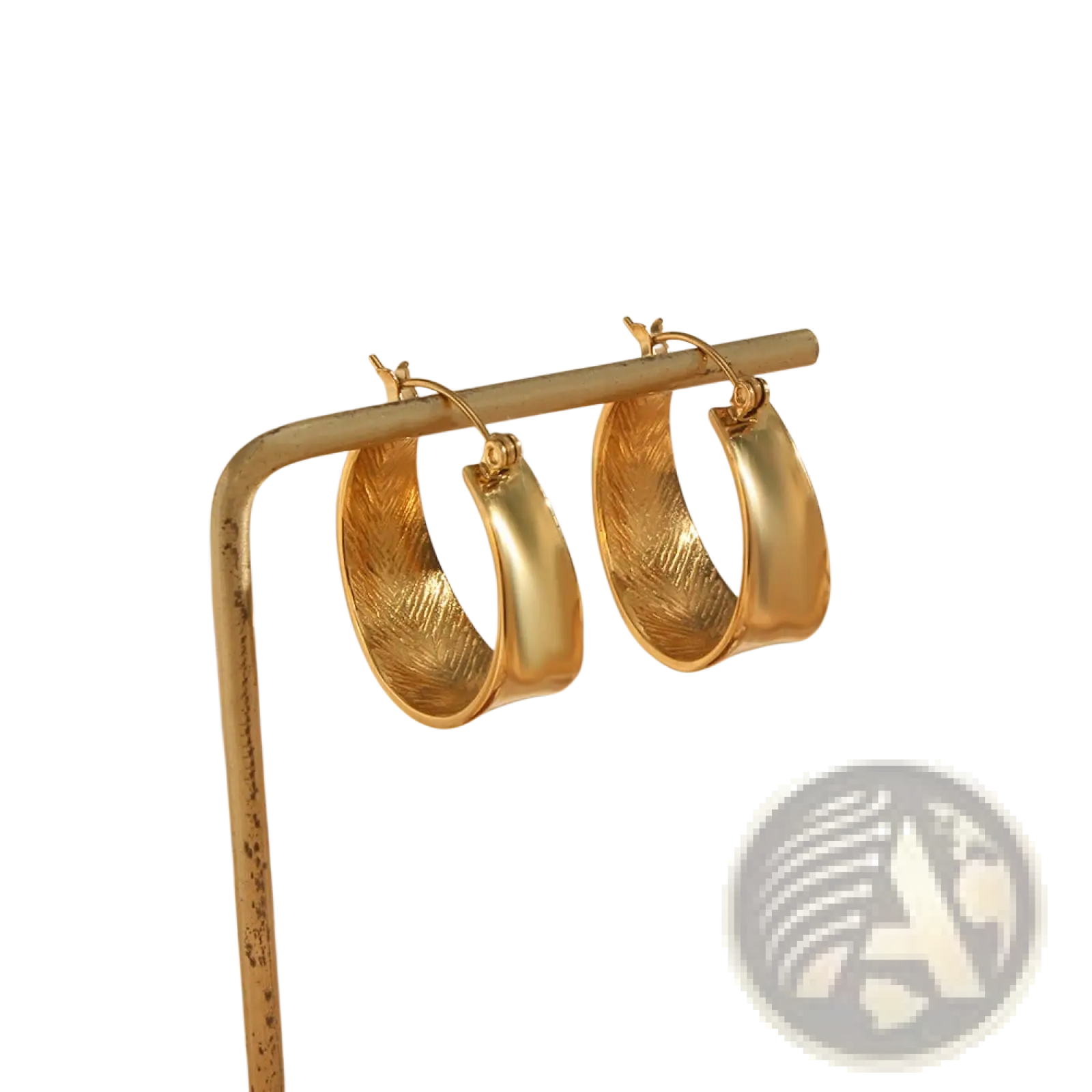 Textured feather interior gold gradient hoop earrings with smooth outer edges showcasing detailed feather pattern