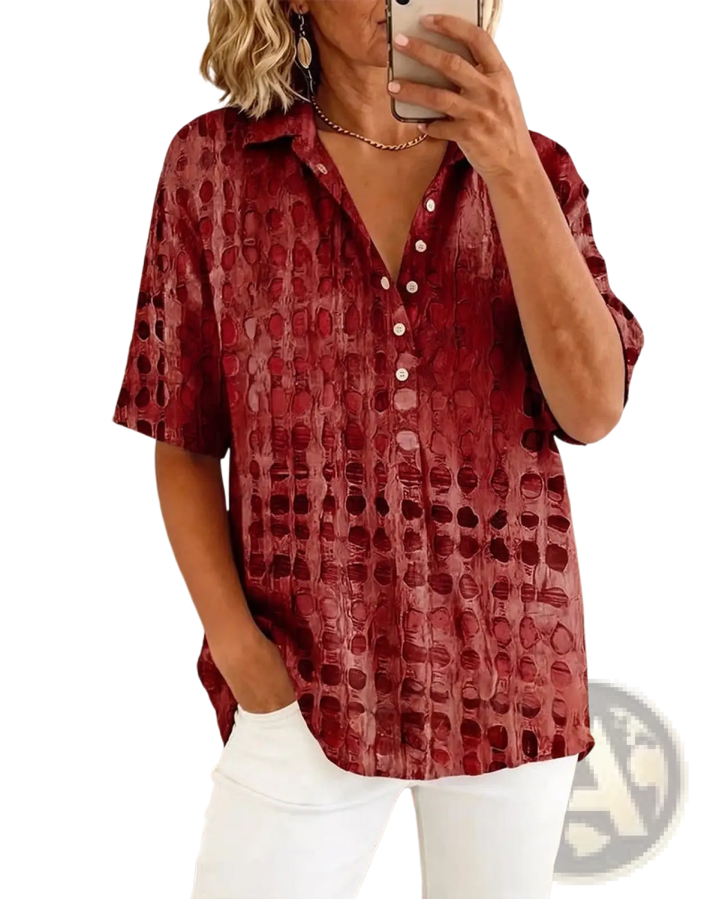 A woman wearing a red textured short sleeve button down pullover with an embossed circular pattern