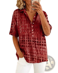 A woman wearing a red textured short sleeve button down pullover with an embossed circular pattern