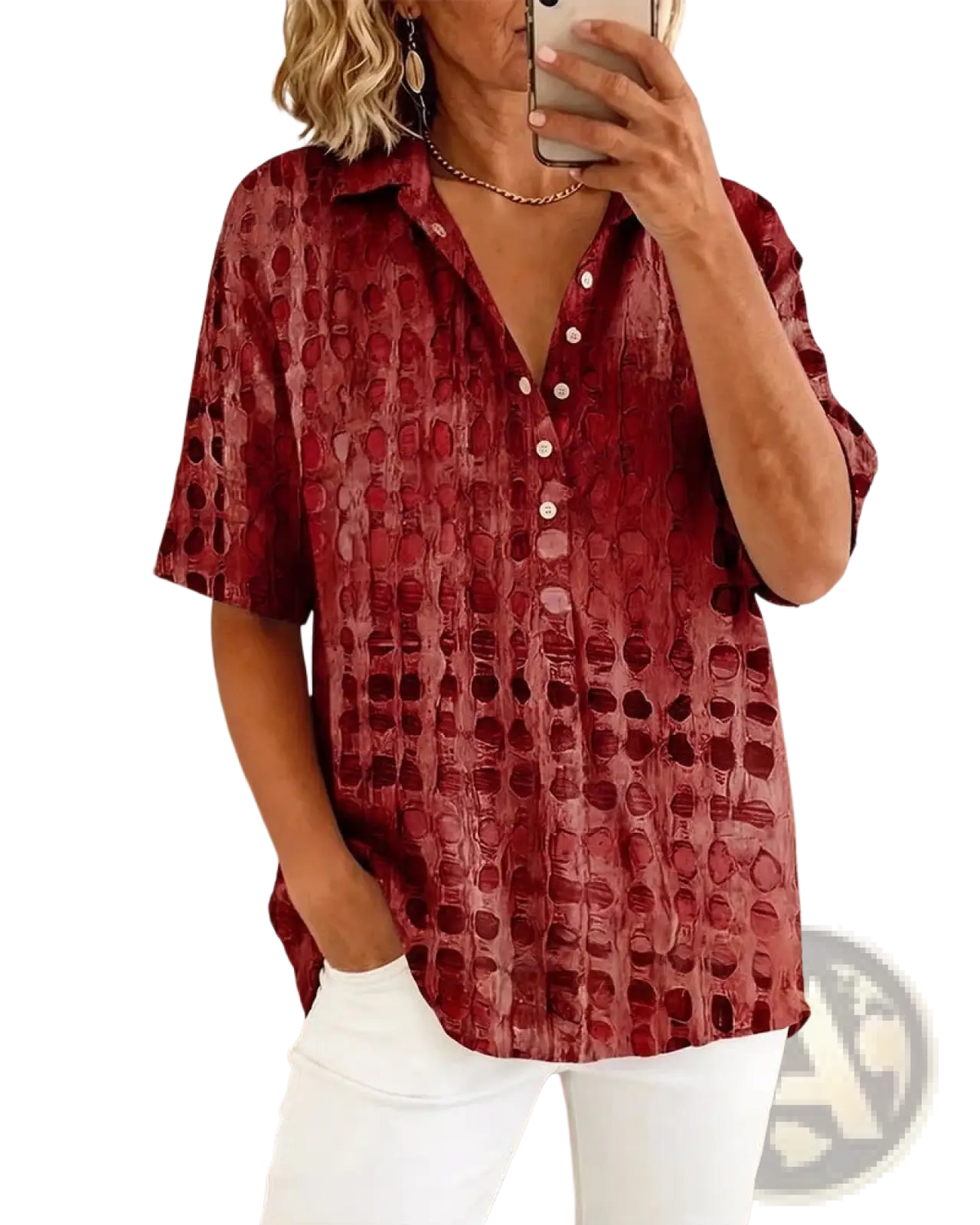 A woman wearing a red textured short sleeve button down pullover with an embossed circular pattern