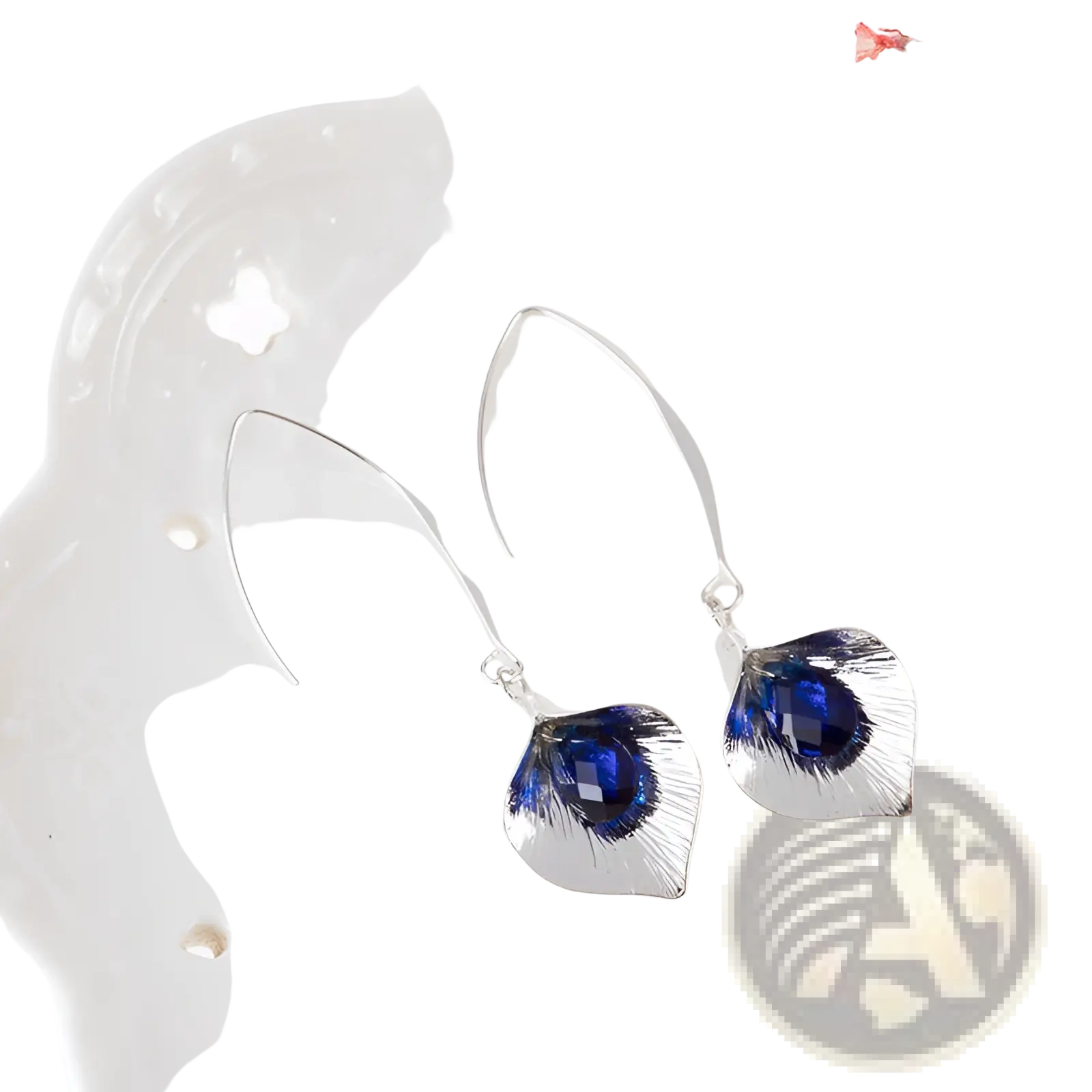 Textured silver orchid crystal drop earrings with silver hooks, peacock feather-shaped pendants, and deep blue gemstones
