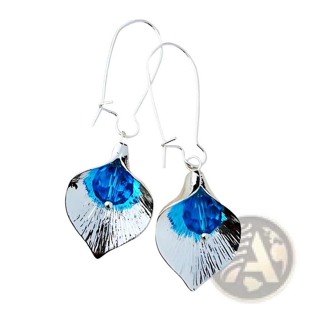 Textured silver orchid crystal drop earrings featuring silver leaf shapes with vibrant blue crystals and brushed metallic finish