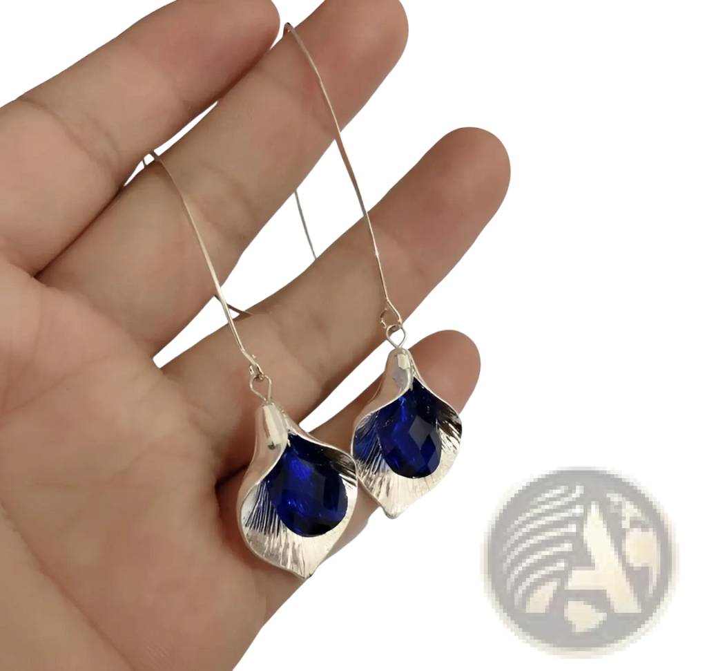 Elegant textured silver orchid crystal drop earrings with silver leaf shapes and deep blue faceted stones