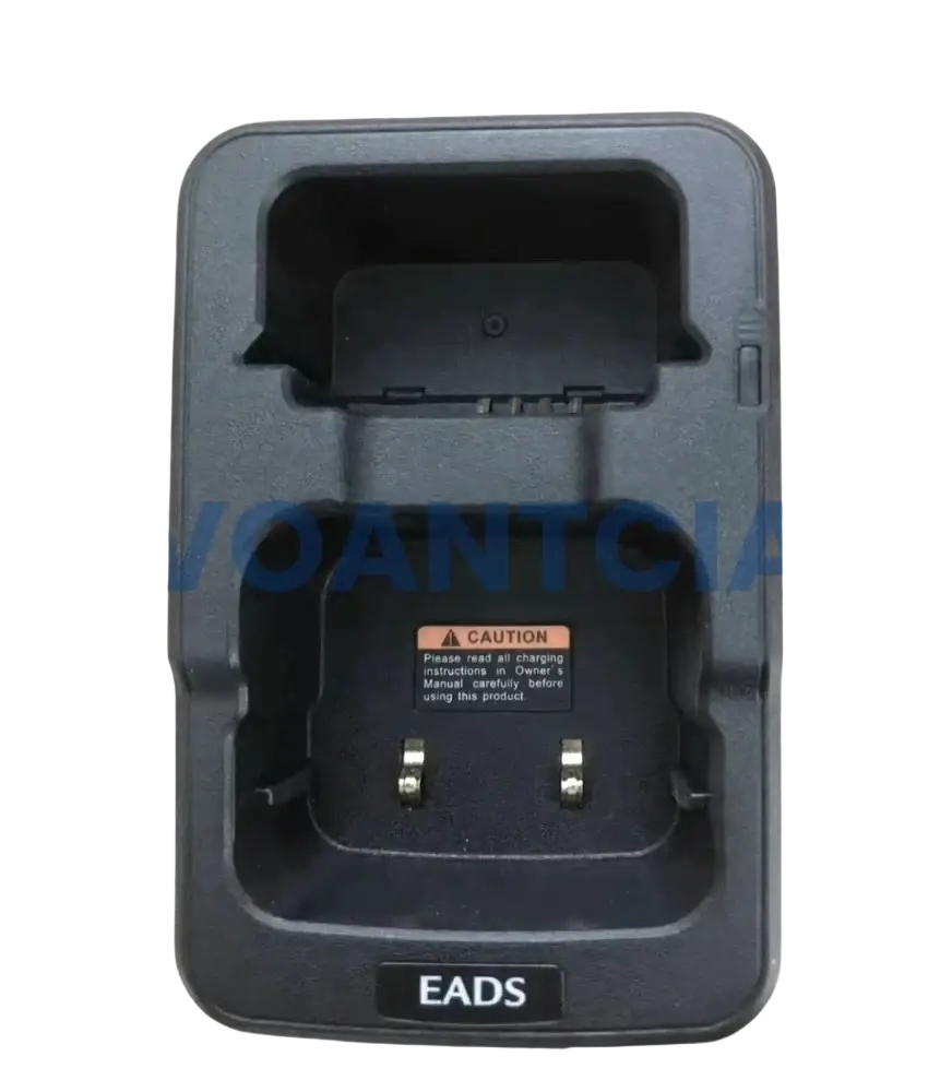 Black plastic th1n th9 thr8 desktop charger with molded compartments and metallic contacts for airbus eads radio