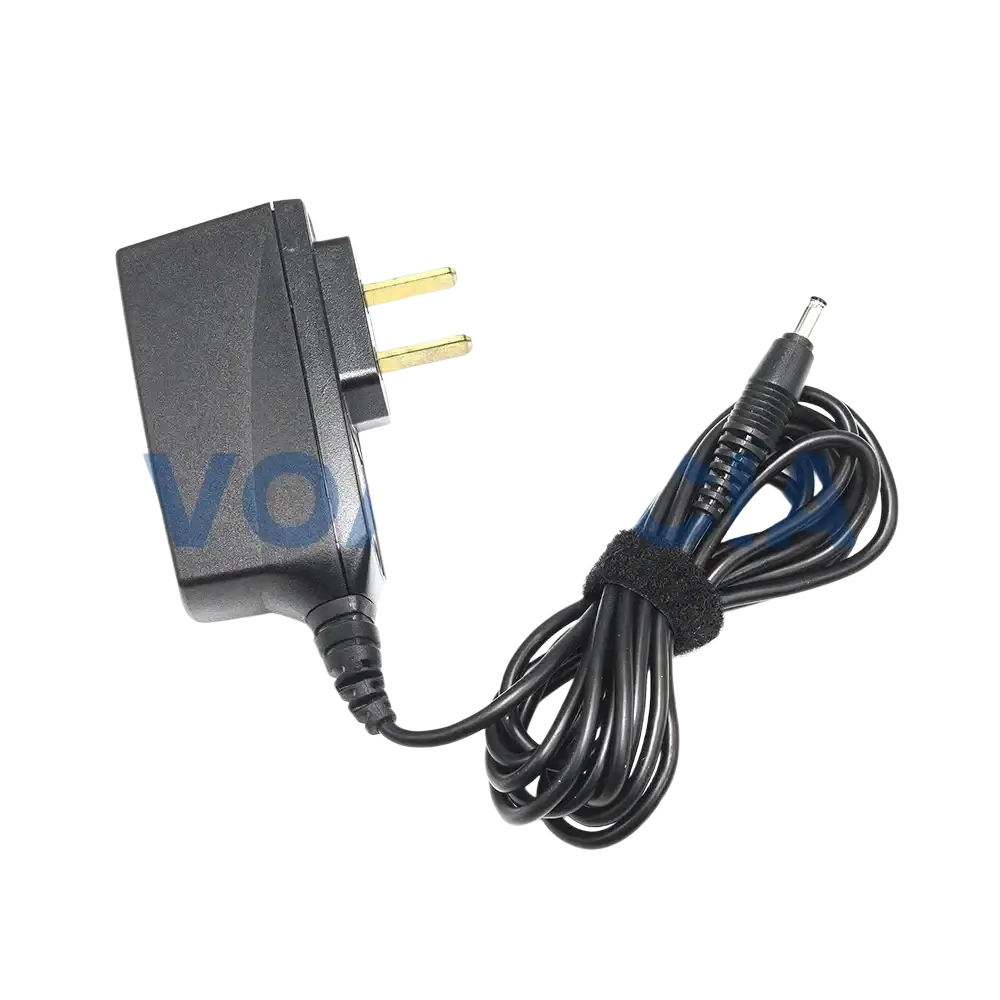 Black plastic th1n th9 thr8 desktop charger with uk two-pin plug and coiled cable for airbus eads radio