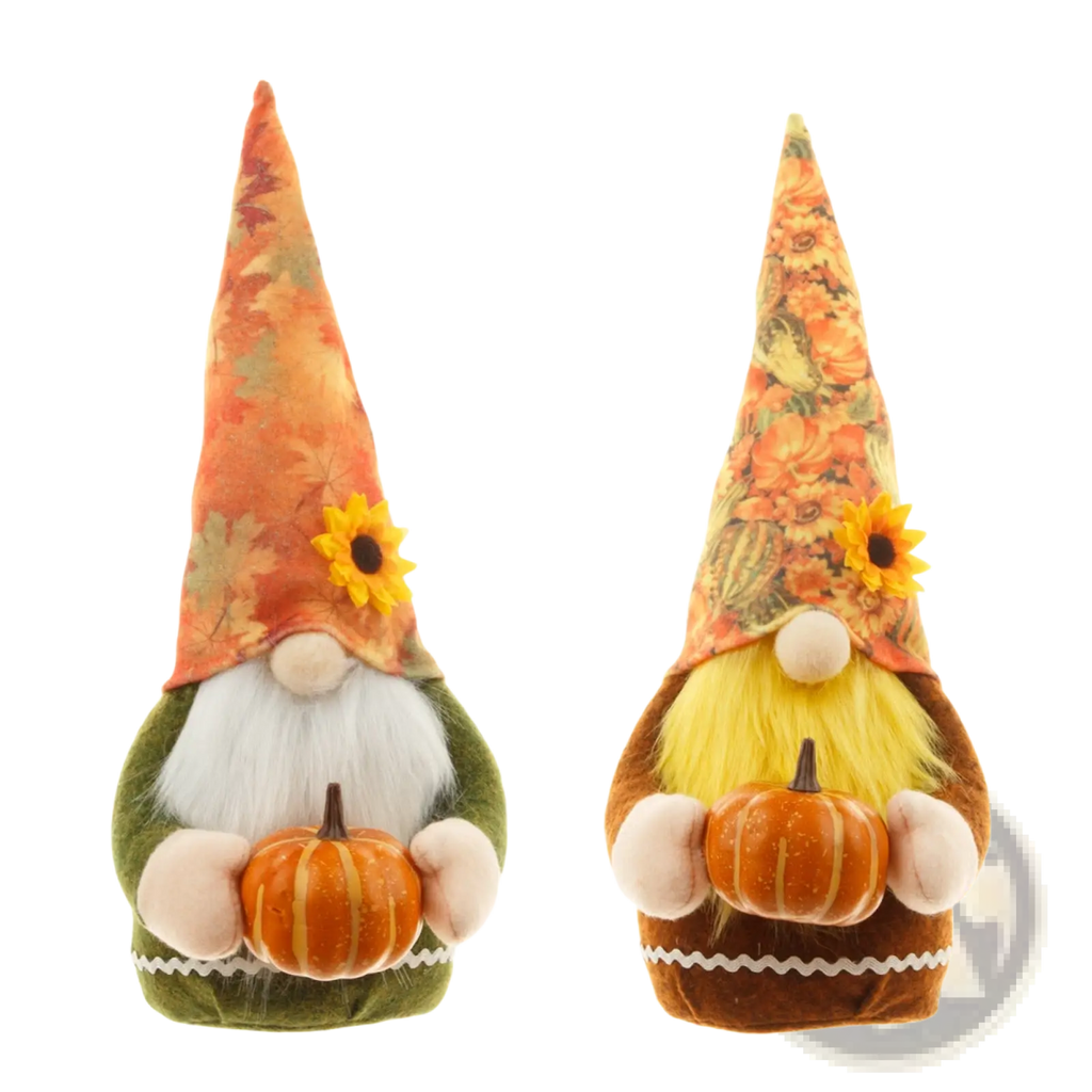 Two plush thanksgiving gnome dolls with autumn-themed hats holding pumpkins in green and brown colors