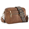 Juniper brown faux leather crossbody bag with gold-tone zippers and decorative black beige white patterned strap