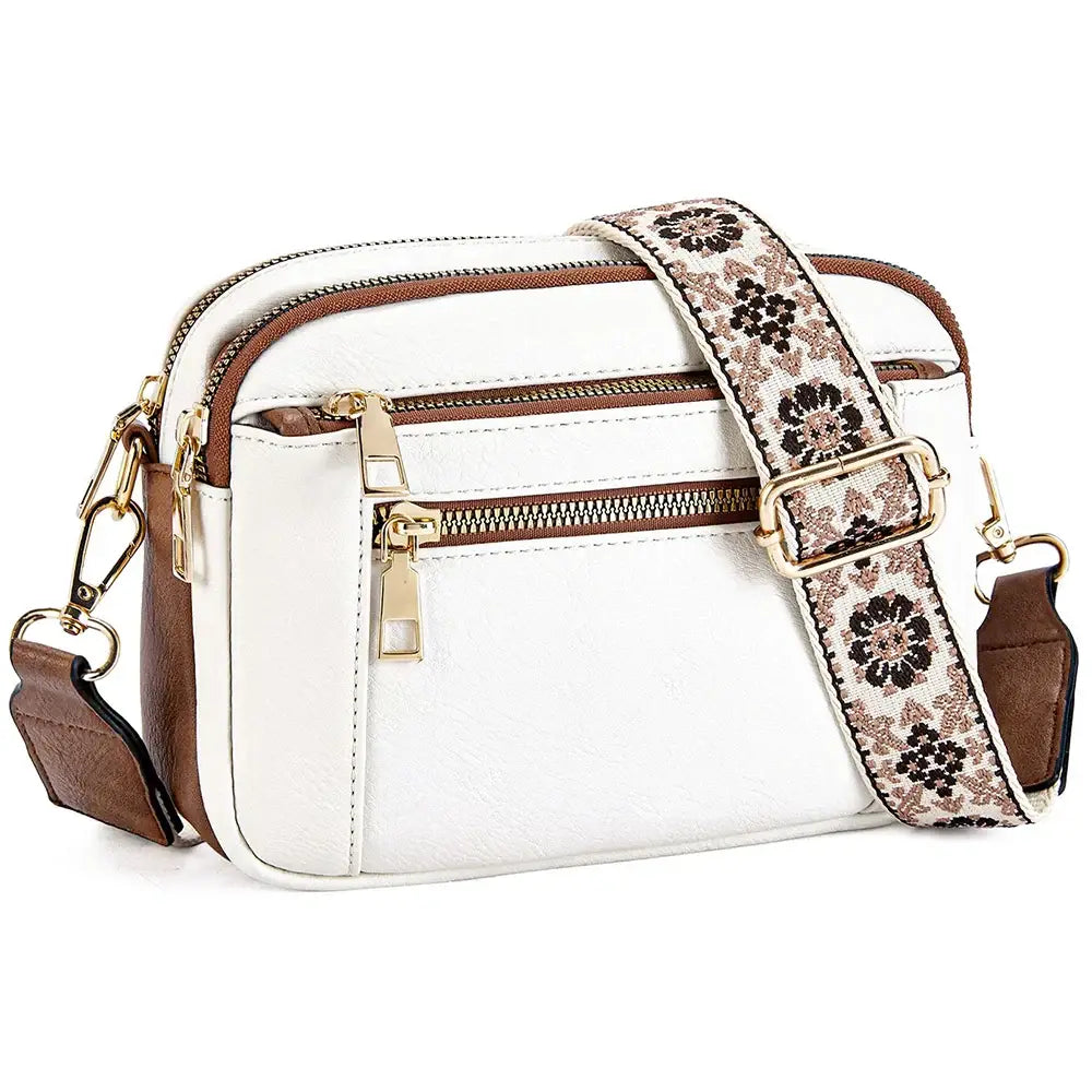 Juniper white floral strap crossbody bag in white and brown with a floral-patterned adjustable strap for everyday use