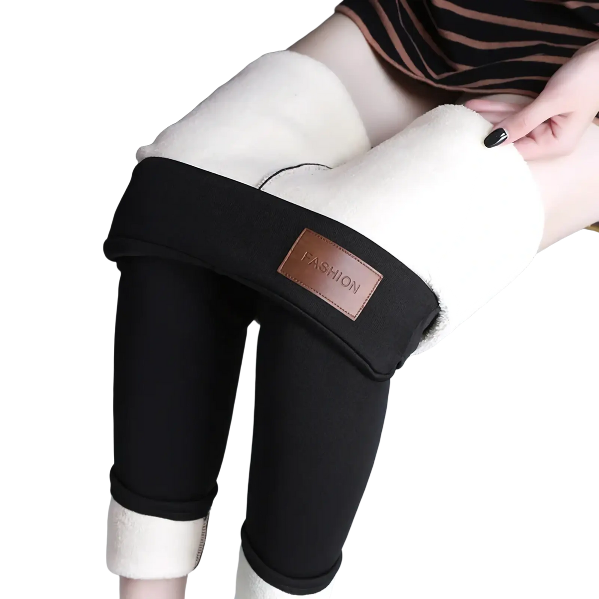 Thermal fleece lined high waist black leggings with plush white fleece interior and brown leather fashion patch on waistband