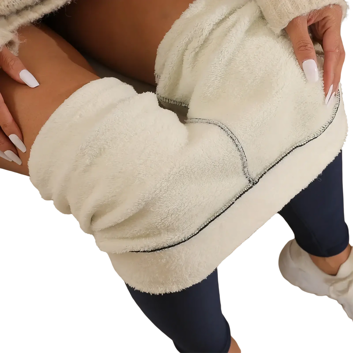 Cream-colored thermal fleece lined high waist leggings with plush material and black contrasting seam stitching