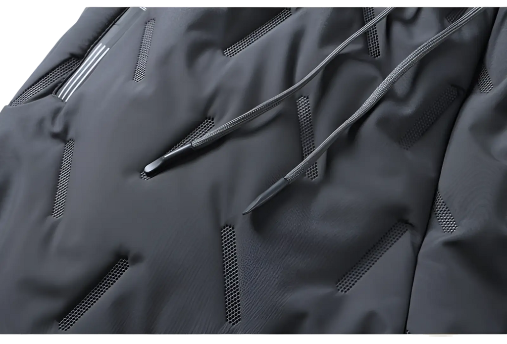 Dark gray thermal fleece lined winter joggers with mesh ventilation panels and matching drawstrings for cold weather use