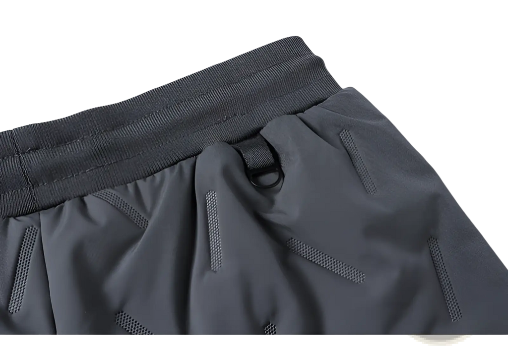 Gray thermal fleece lined winter joggers with ribbed elastic waistband and subtle mesh paneling for breathability
