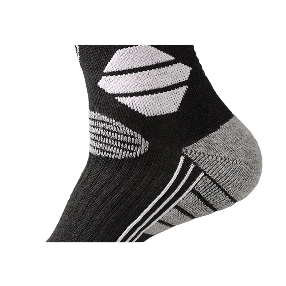Thermal knee high ski socks in black with white and gray accents feature a u-shaped heel design for comfort