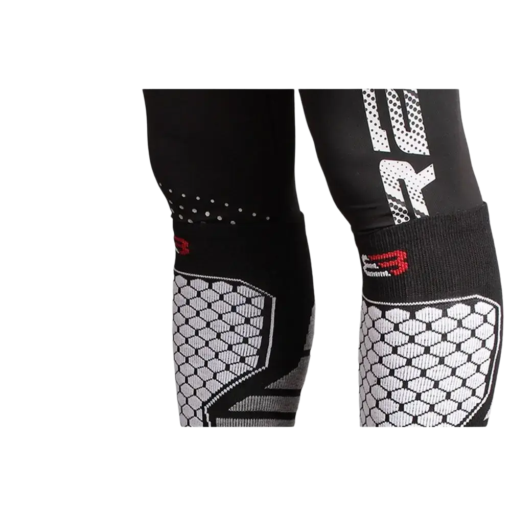 Thermal knee high ski socks with black and white compression sleeves featuring hexagonal pattern and red branding accents