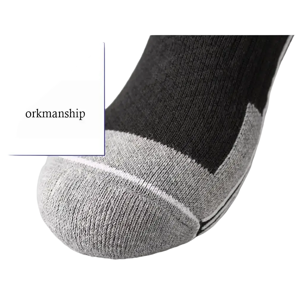 Thermal knee high ski socks in gray and black feature reinforced toe and heel with subtle white stitching details